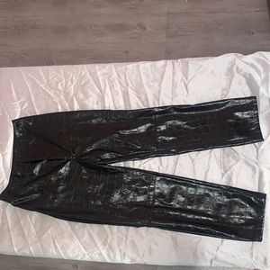 Black crocodile print leather pants.